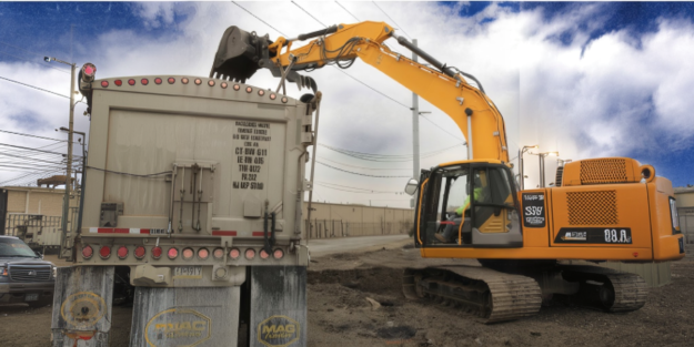 ERC excavator loading PCB-impacted soil at an industrial site in Columbus, Ohio