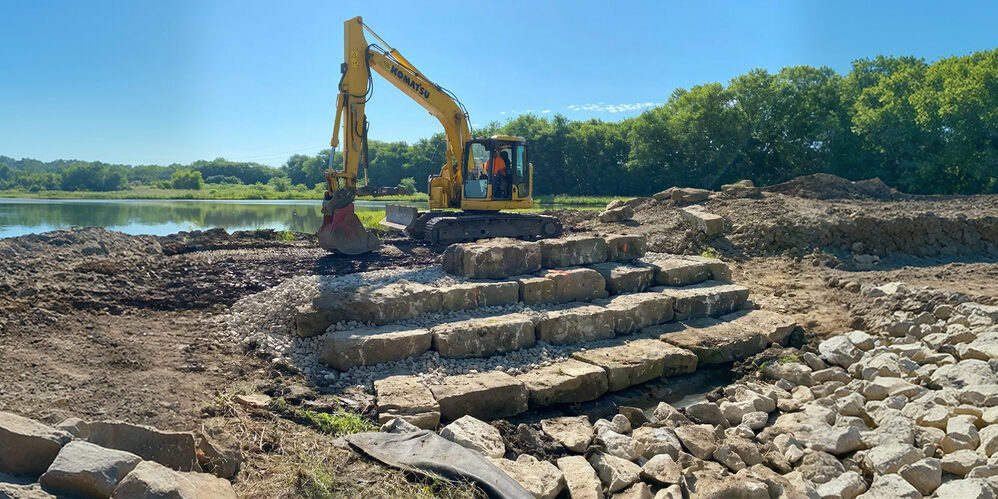 Boulder cascade and flagstone transition in a restored wetland