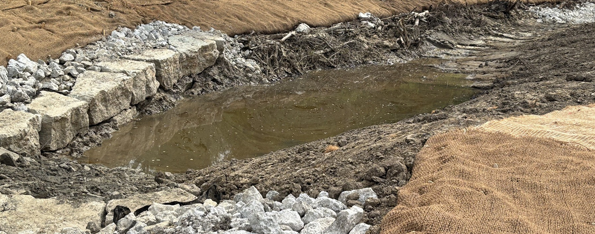 Boulder cross vane grade-control structure installed during stream restoration